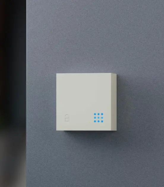 Akiles Gateway gemonteerd aan een donkere wand